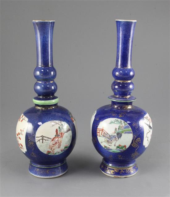 Two similar Chinese powder blue ground famille verte bottle vases, Kangxi period, height 27.7cm